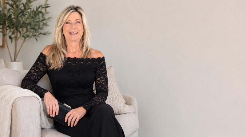 Portrait of Lisa Redman in a warm ivory interior