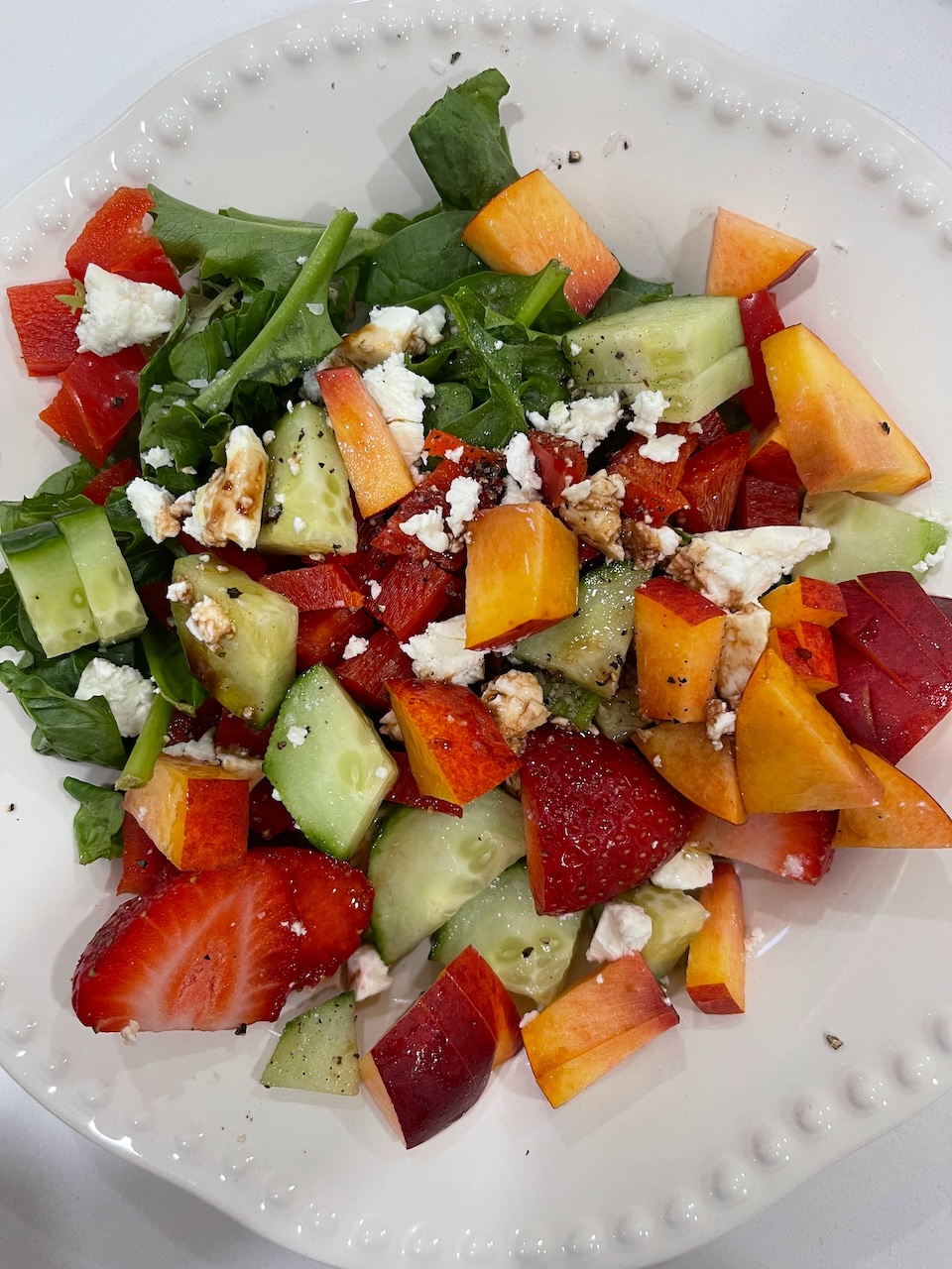 Summer salad with stone fruit, strawberries and feta